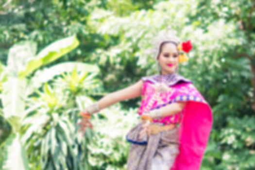 Asian woman wearing typical, traditional Thai Dress. It is literally means "Thai outfit", National costume.
