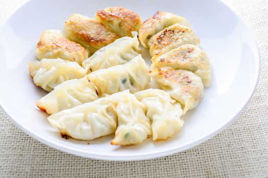 Japanese Fried Dumplings, the half moon-shaped dumplings served in Asian restaurants as an appetiser or side dish, pork and vegetable filling.

