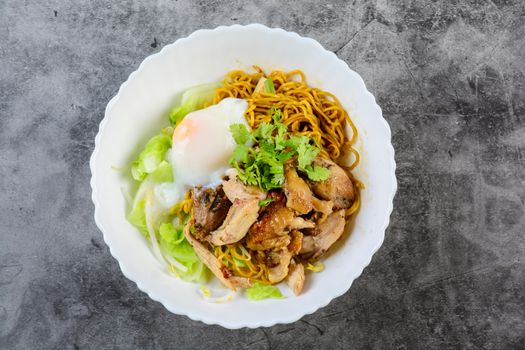 Egg noodles served dry with roasted honey chicken and soft-boiled eggs (onsen tamago eggs)
