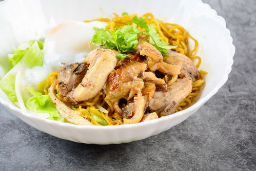 Egg noodles served dry with roasted honey chicken and soft-boiled eggs (onsen tamago eggs)
