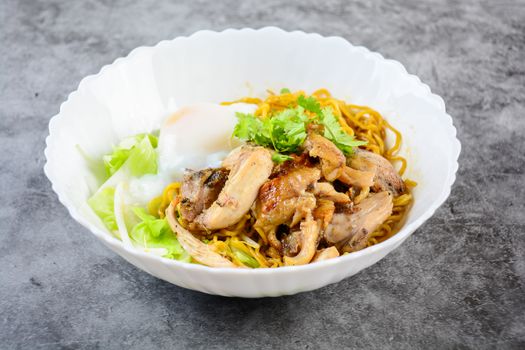 Egg noodles served dry with roasted honey chicken and soft-boiled eggs (onsen tamago eggs)
