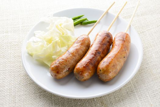 Thai Spicy Sausages, made from minced pork mixed with a variety of ingredients which makes it packed with flavour, and gives it a unique scent.
