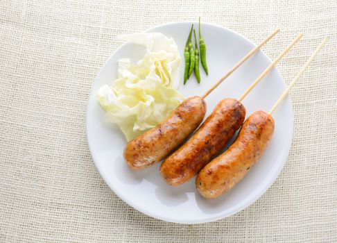 Thai Spicy Sausages, made from minced pork mixed with a variety of ingredients which makes it packed with flavour, and gives it a unique scent.
