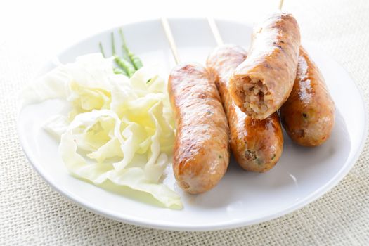 Thai Spicy Sausages, made from minced pork mixed with a variety of ingredients which makes it packed with flavour, and gives it a unique scent.
