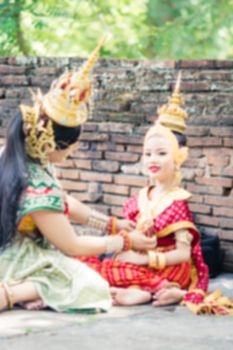 Asian woman wearing typical, traditional Thai Dress. It is literally means "Thai outfit", National costume.
