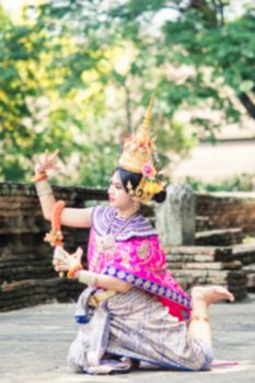 Asian woman wearing typical, traditional Thai Dress. It is literally means "Thai outfit", National costume.
