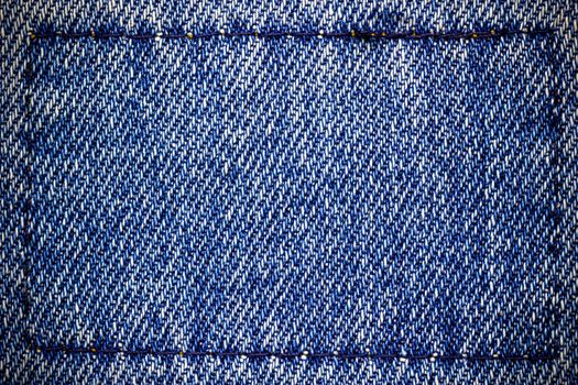 Frame or border of jeans fabric stitch. Concept of vintage clothes or fashion.