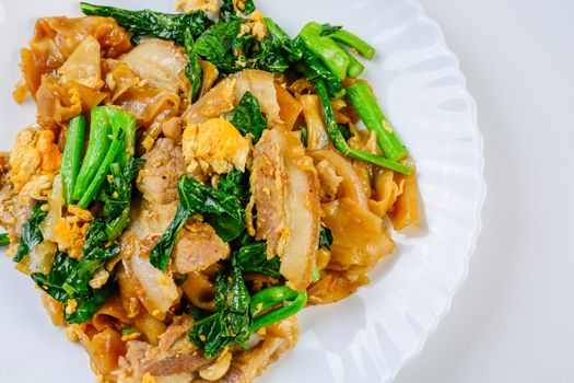 Stir-fried Fresh Rice-flour Noodles With Sliced Pork, Egg and Kale. Quick noodle stir-fry.