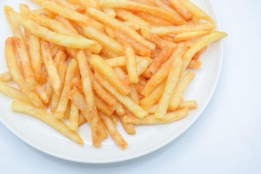 French fries on white dish and white background.