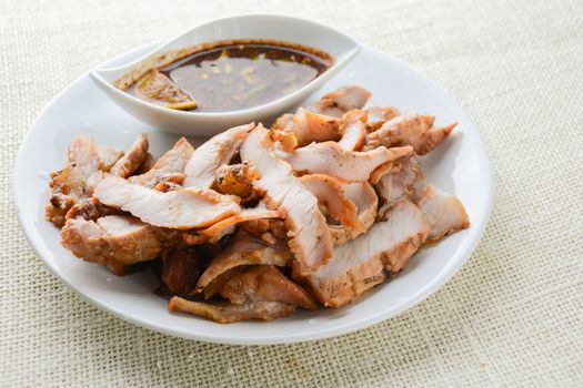 Grilled Pork with Thai Spicy Sauce, it can be served as an appetizer; it can also be served as an entrée with hot-off-the-splatter-guard sticky rice or plain steamed jasmine rice.