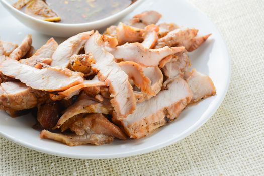 Grilled Pork with Thai Spicy Sauce, it can be served as an appetizer; it can also be served as an entrée with hot-off-the-splatter-guard sticky rice or plain steamed jasmine rice.