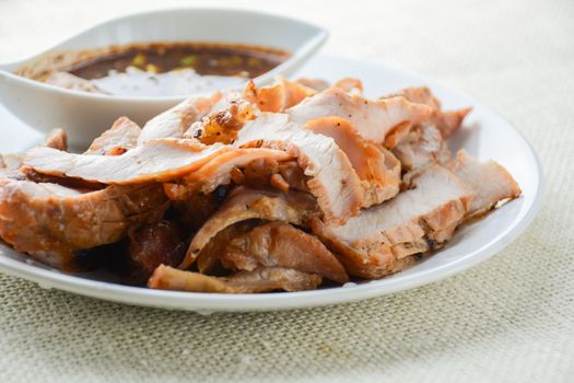 Grilled Pork with Thai Spicy Sauce, it can be served as an appetizer; it can also be served as an entrée with hot-off-the-splatter-guard sticky rice or plain steamed jasmine rice.