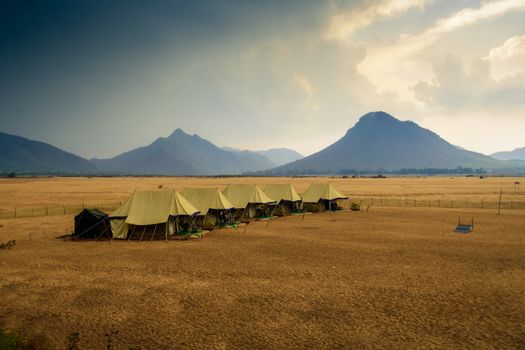 Swiss tents in the sand surrounded by Eastern Ghat mountain range with copy space