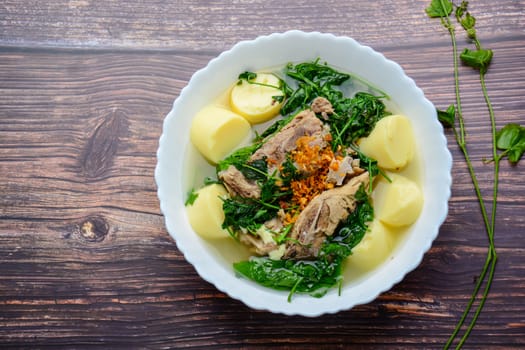 Ivy gourd soup with Soft white bean curd and pork bone
