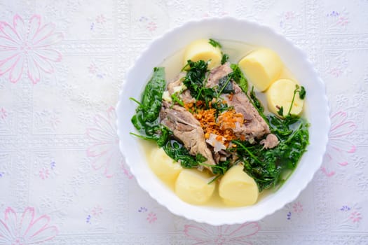 Ivy gourd soup with Soft white bean curd and pork bone
