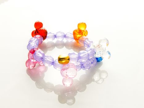 Multi-colored bracelets with beads. Colourful child's bead bracelet.
