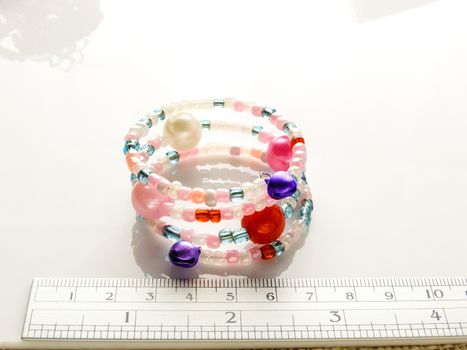 Multi-colored bracelets with beads. Colourful child's bead bracelet.
