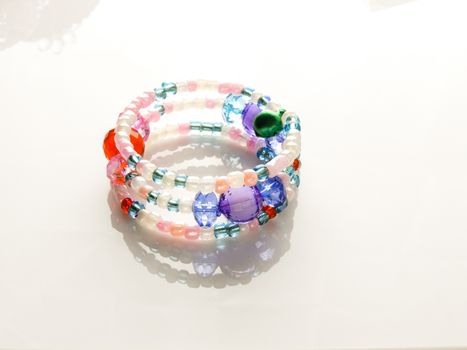 Multi-colored bracelets with beads. Colourful child's bead bracelet.
