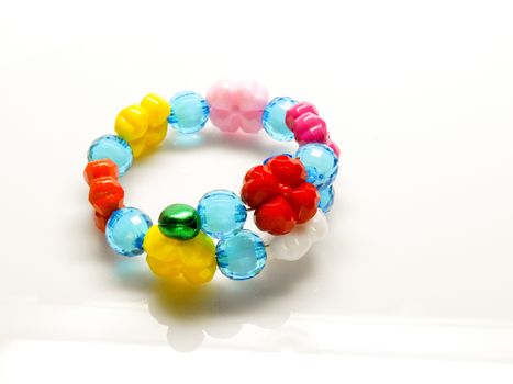 Multi-colored bracelets with beads. Colourful child's bead bracelet.
