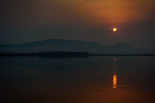 Sunrise over Mahanadi river, Odisha, Eastern Ghat mountain range, copy space