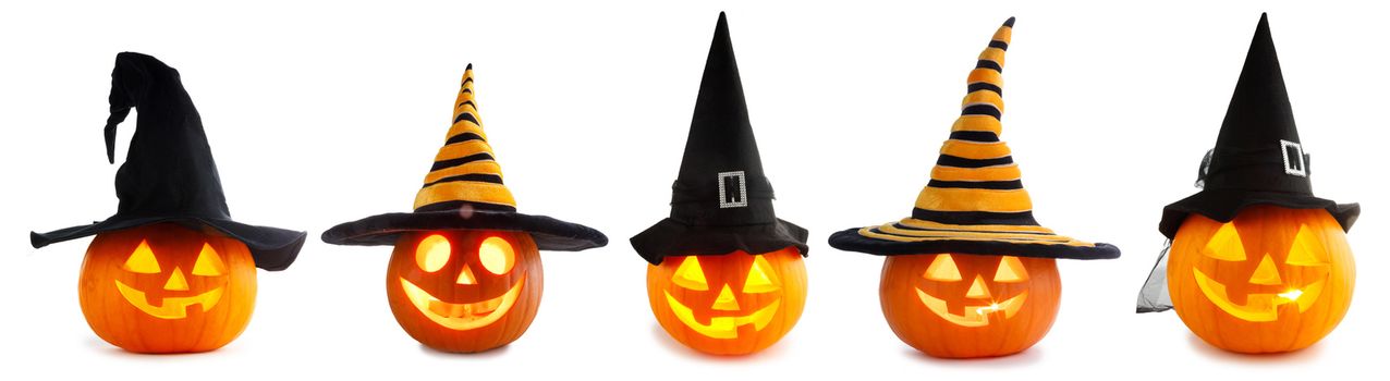 A collection of Jack O Lantern Halloween pumpkins with various different designs and witches hat in a row isolated on white background