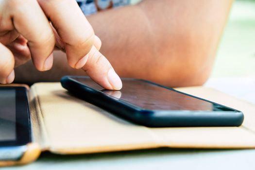 close up image of Phone on hands.