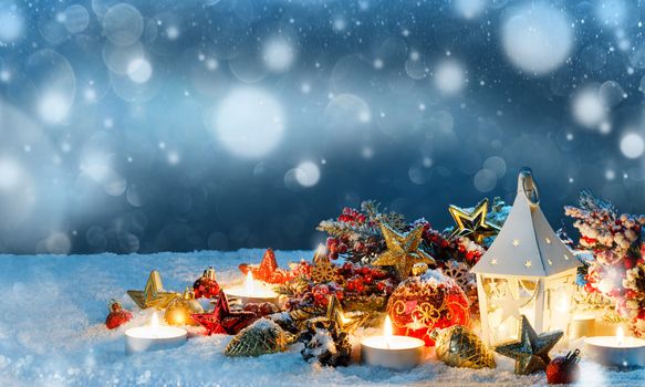 Burning candles , lantern and christmas decoration on magic bokeh lights background