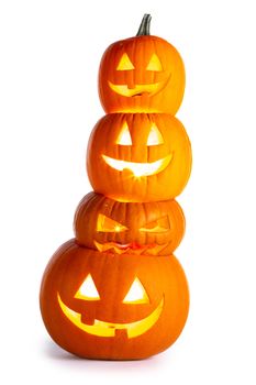 Stack of glowing Halloween Pumpkins isolated on white background