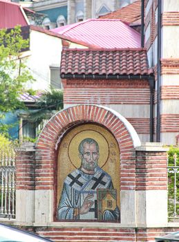 Icon on the facade of the fence of St. Nicolas Church, Batumi, Georgia