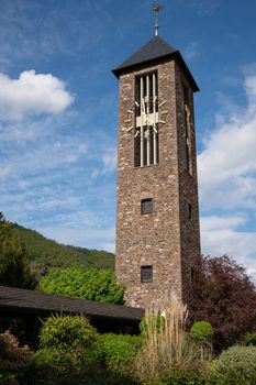 Bell tower of monastery Ebernach with blue sky, Cochem, Germany