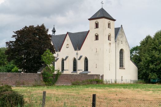 Panoramic image of the old parish church of Cologne Duennwald on a cloudy day, Germany