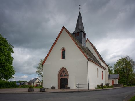 Panoramic image of the pilgrim church Maria and Maria Magdalena of Valwigerberg with cloudy sky, Cochem, Germany