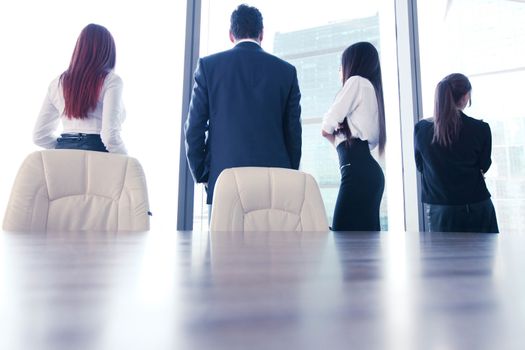 Rear view of business people looking at window