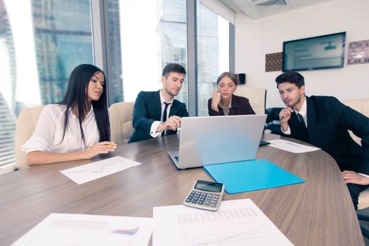 Business people working together at a meeting in modern office