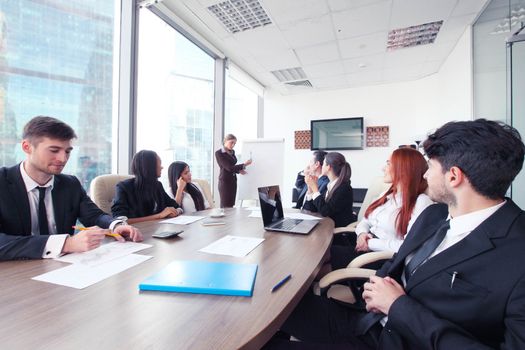 Business presntation on meeting of diverse people around the table