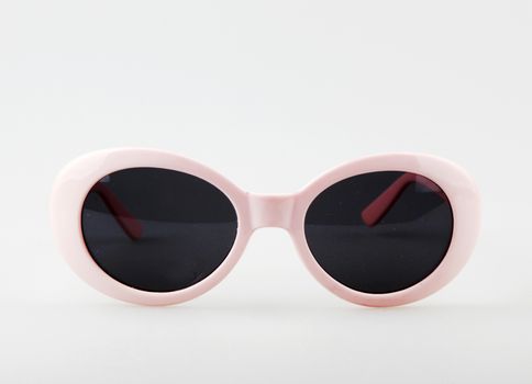 Women's Pink Sunglasses Against White Background