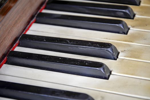 close-up view of the keys of a ancient ruined piano