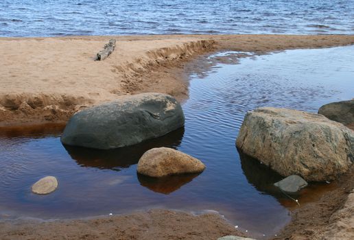 
Beautiful landscape with boulders on the lake.