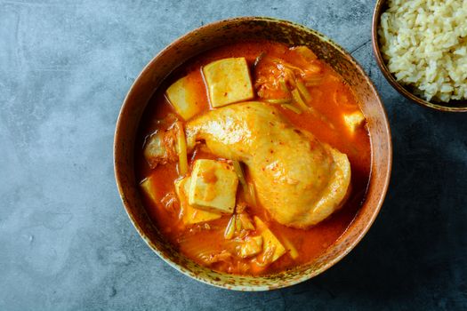 Korean traditional Kimchi soup with chicken and soft tofu
