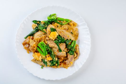 Stir-fried Fresh Rice-flour Noodles With Sliced Pork, Egg and Kale. Quick noodle stir-fry.