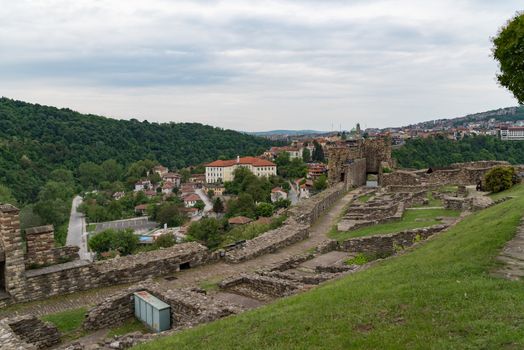 Towers and walls of Tsarevets fortress with a view of the old town of Veliko Tarnovo in the background, Bulgaria