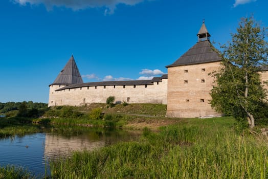 View to Elena river, Gate Tower and Strelochnaya Tower of the old medieval Old Ladoga Fortress in Russia