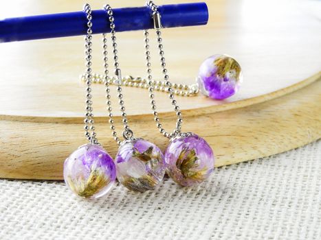 Dried flower in crystal clear resin pendant necklace, pendant with a real flowers. 
