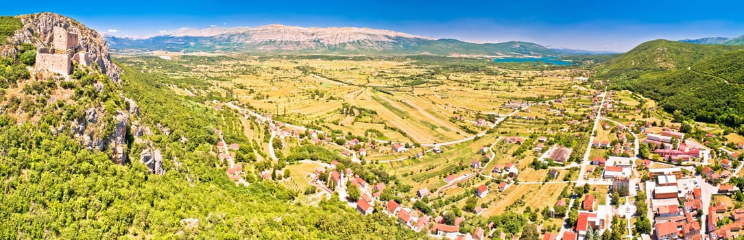 Town of Vrlika and Peruca lake aerial panoramic view, Dalmatian Zagora region of Croatia