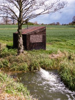 drainage ditch and pump house to save lowland fields from flooding