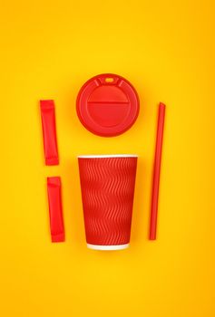 Close up one crimped disposable red paper takeaway cup, plastic cap, two sugar sachets and drinking straw over vivid yellow background, flat lay, elevated top view, directly above