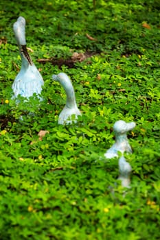 3 Ducks statue decorated in green garden, Selective focus in green garden, Selective focus