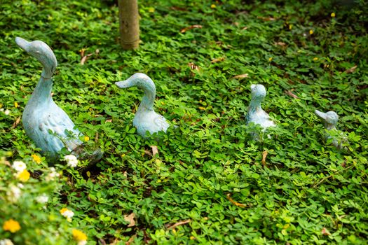4 Ducks statue decorated in green garden, Selective focus in green garden, Selective focus