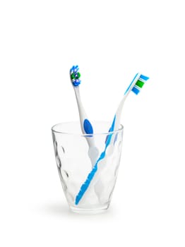 Toothbrushes in glass isolated on white background. With clipping path