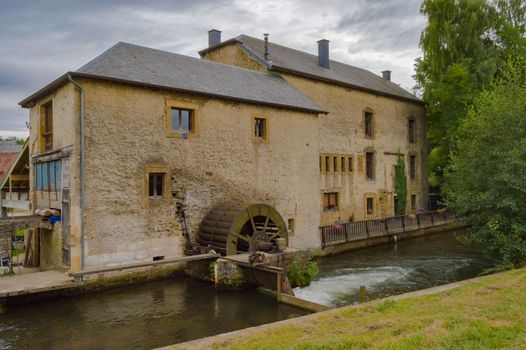 Old water mill on the tuna river running through the city of Virton eprovince du Luxembourg in Belgium